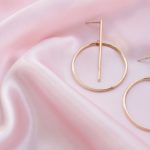 gold hoop earrings on pink fabric 2021 11 04 21 10 06 utc scaled