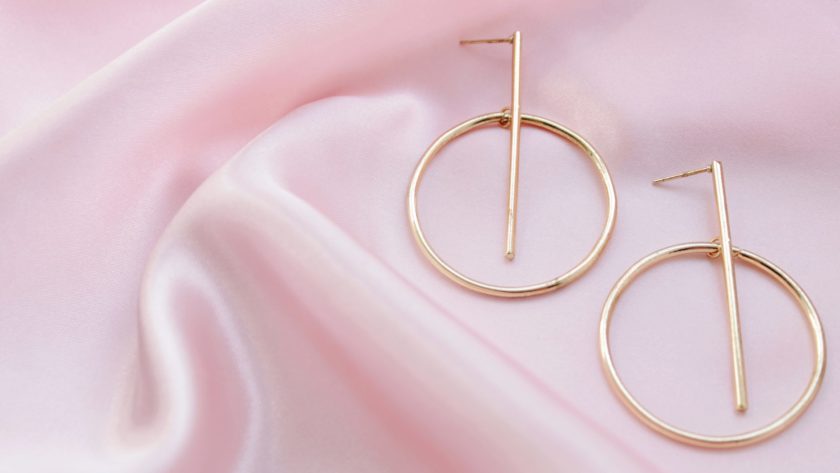 gold hoop earrings on pink fabric 2021 11 04 21 10 06 utc scaled
