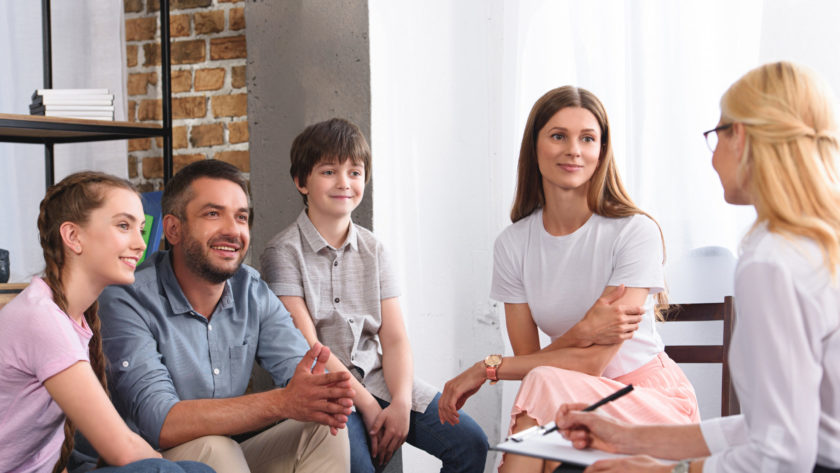 happy family sitting on therapy session by female 2021 08 29 22 51 23 utc scaled