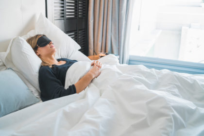 Woman sleeping with sleep mask