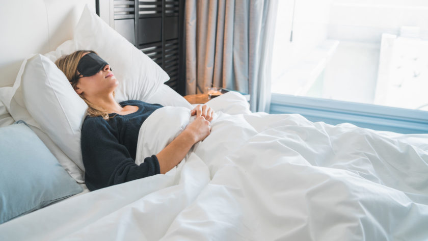 Woman sleeping with sleep mask