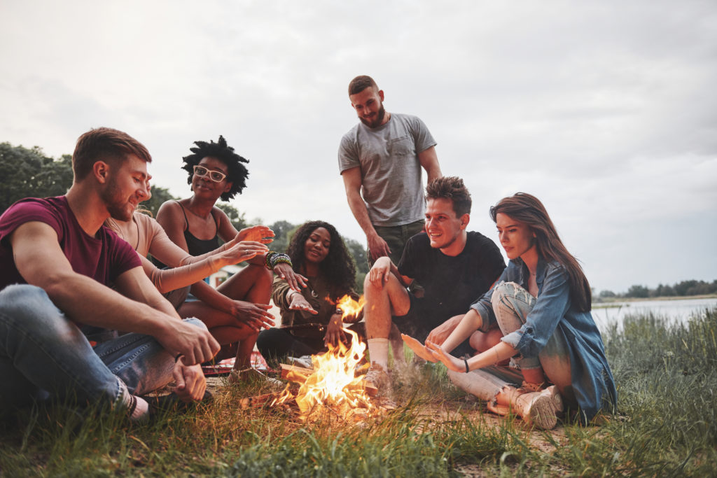 Summer beach party. Group of people have picnic. Friends have fun at weekend time