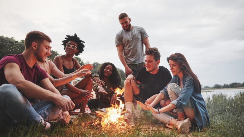 Summer beach party. Group of people have picnic. Friends have fun at weekend time