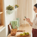 Elegant Woman Using Smartphone at Home