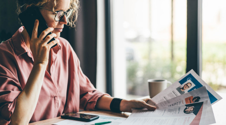 Types of Crimes and Offenses You Might Find in a Background Check 4 Manager looking at many different cv resume and choosing perfect person.