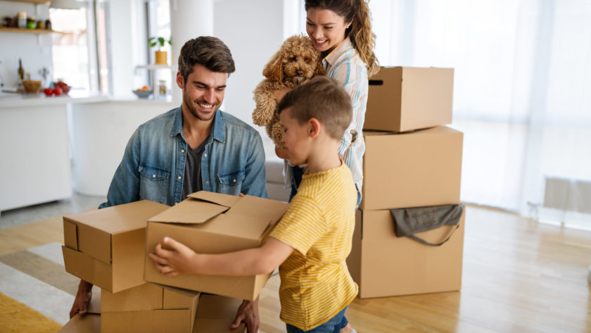 family unpacking cardboard boxes at new home 2021 09 02 07 57 46 utc scaled