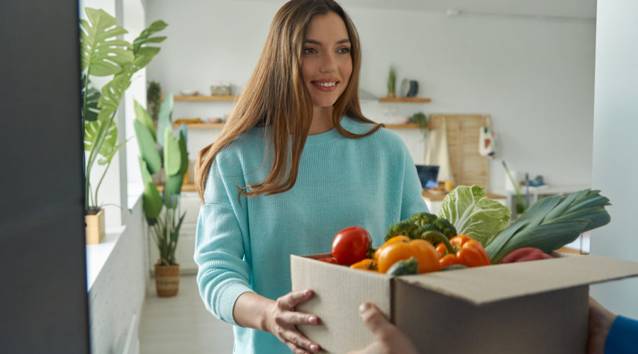 Vital Services for US Homeowners 3 happy young woman accepting box with groceries fro 2022 10 28 05 39 38 utc