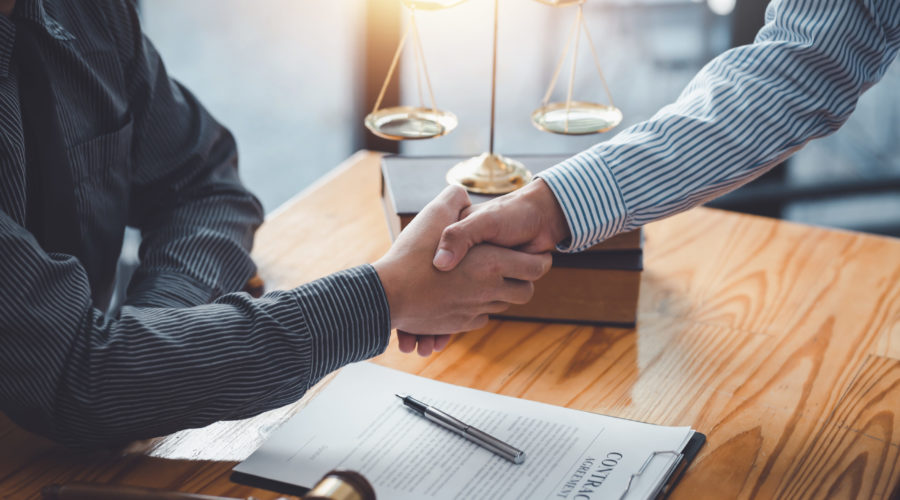 Protecting Your Assets: What Your Prenup Attorney Should Know 3 businessman handshake partner lawyers or attorneys 2023 01 25 10 36 09 utc scaled