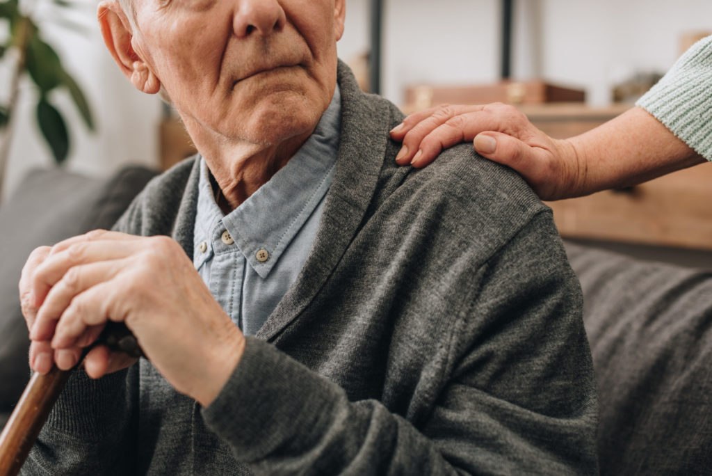 cropped view of sad pensioner with wife hands on s 2022 12 16 19 27 07 utc scaled