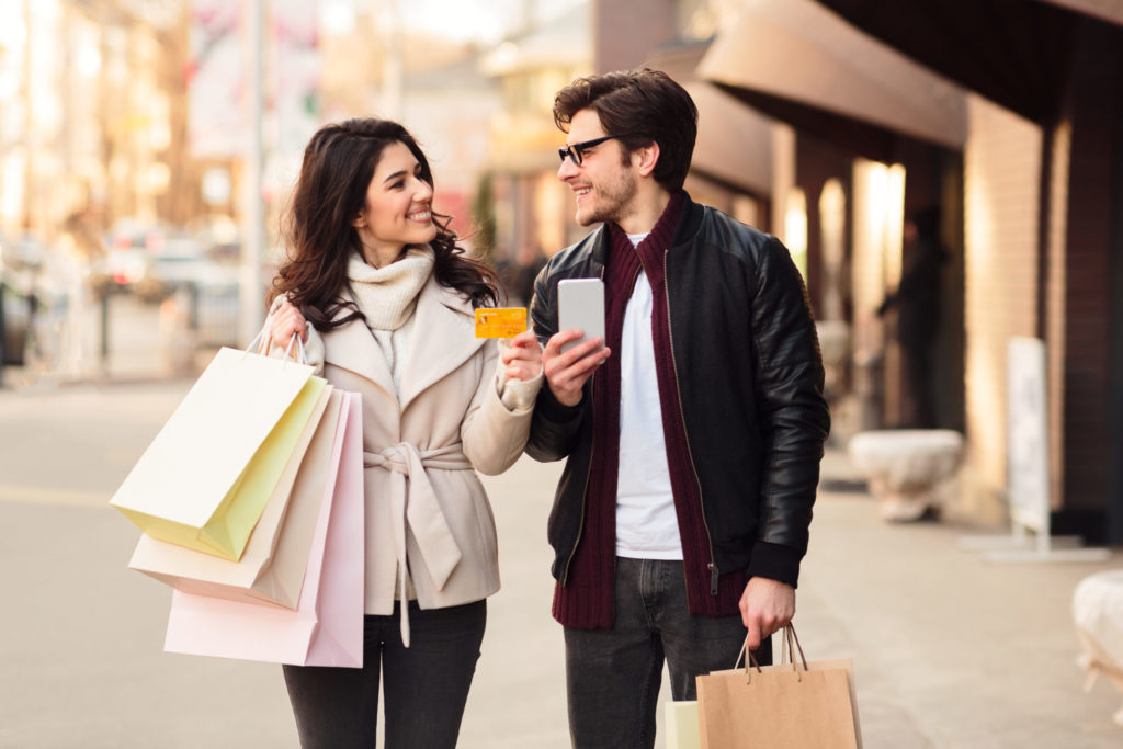 easy shopping happy couple using smartphone and c 2022 12 16 08 03 30 utc scaled