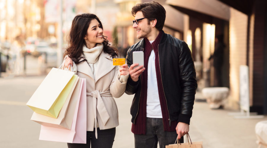 easy shopping happy couple using smartphone and c 2022 12 16 08 03 30 utc scaled